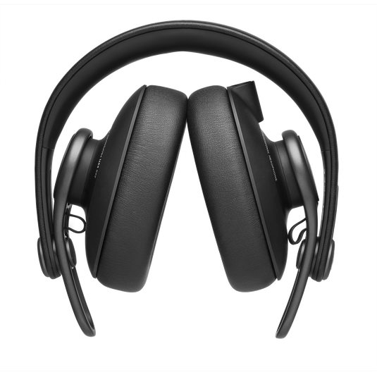 Folded black AKG K371 Over-ear, closed-back, foldable studio headphones with oval ear cups and padded headband.
