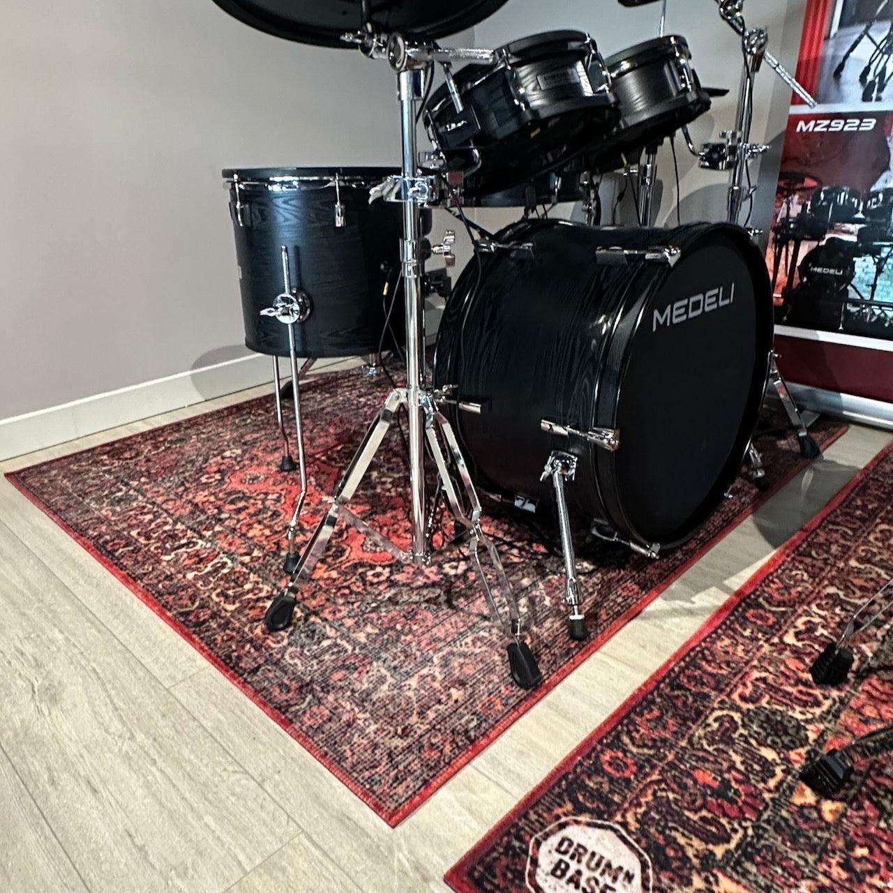 DRUMnBASE Sound STAGE 150×130cm Persian Worn Red Vibration Isolation carpet under a black Medeli drum kit