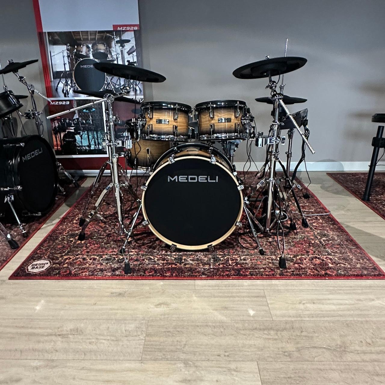 DRUMnBASE Sound STAGE 185×165cm Persian Worn Red Vibration Isolation carpet under a drum kit in a studio setting