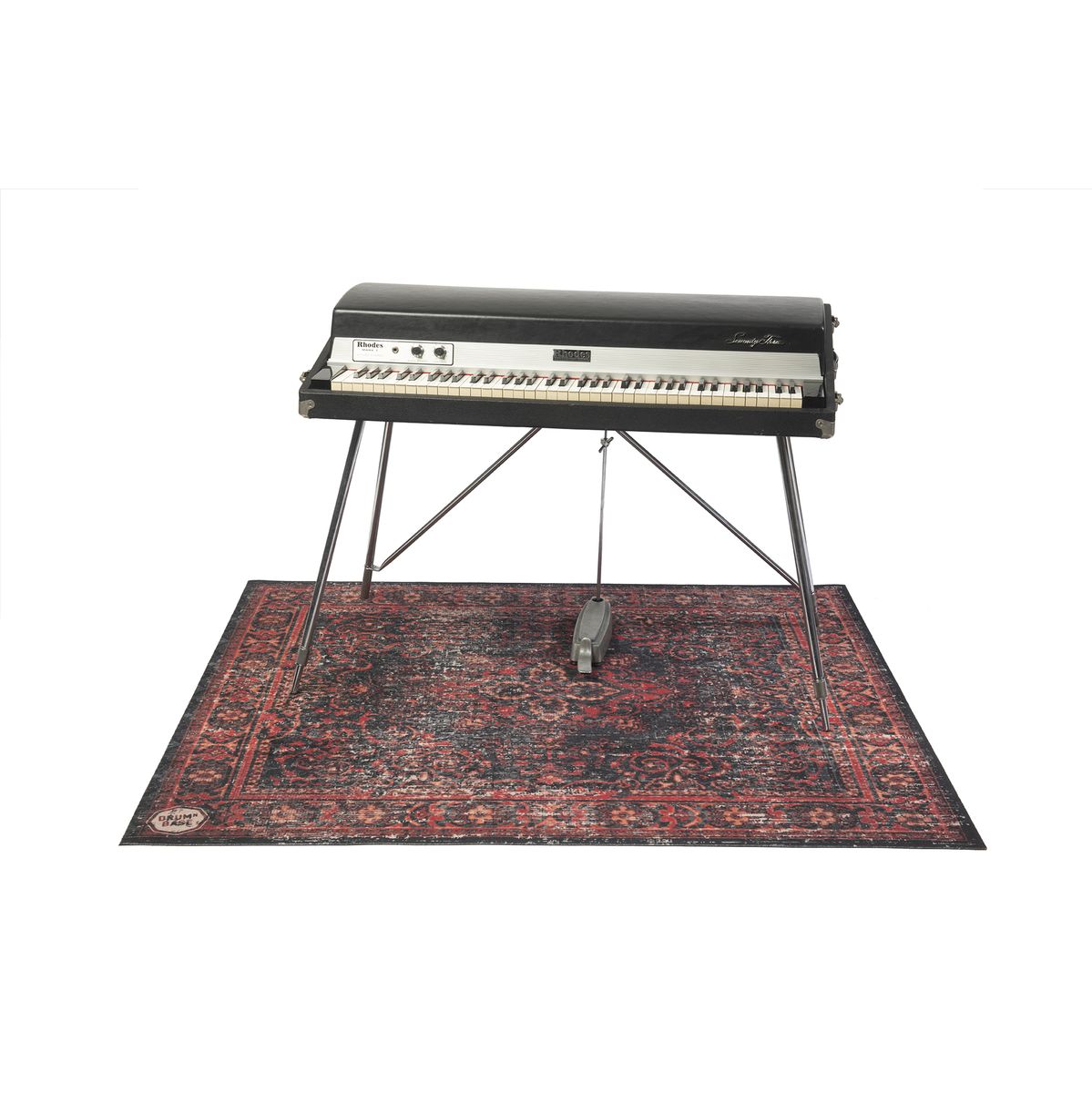 DRUMnBASE Vintage Persian Club Series Black Red 165x142cm carpet beneath a vintage keyboard stand with pedal.