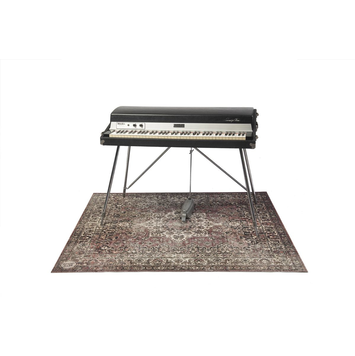 Electric keyboard on a stand placed on DRUMnBASE Vintage Persian Club Series Classic Worn 165x142cm carpet mate in worn red