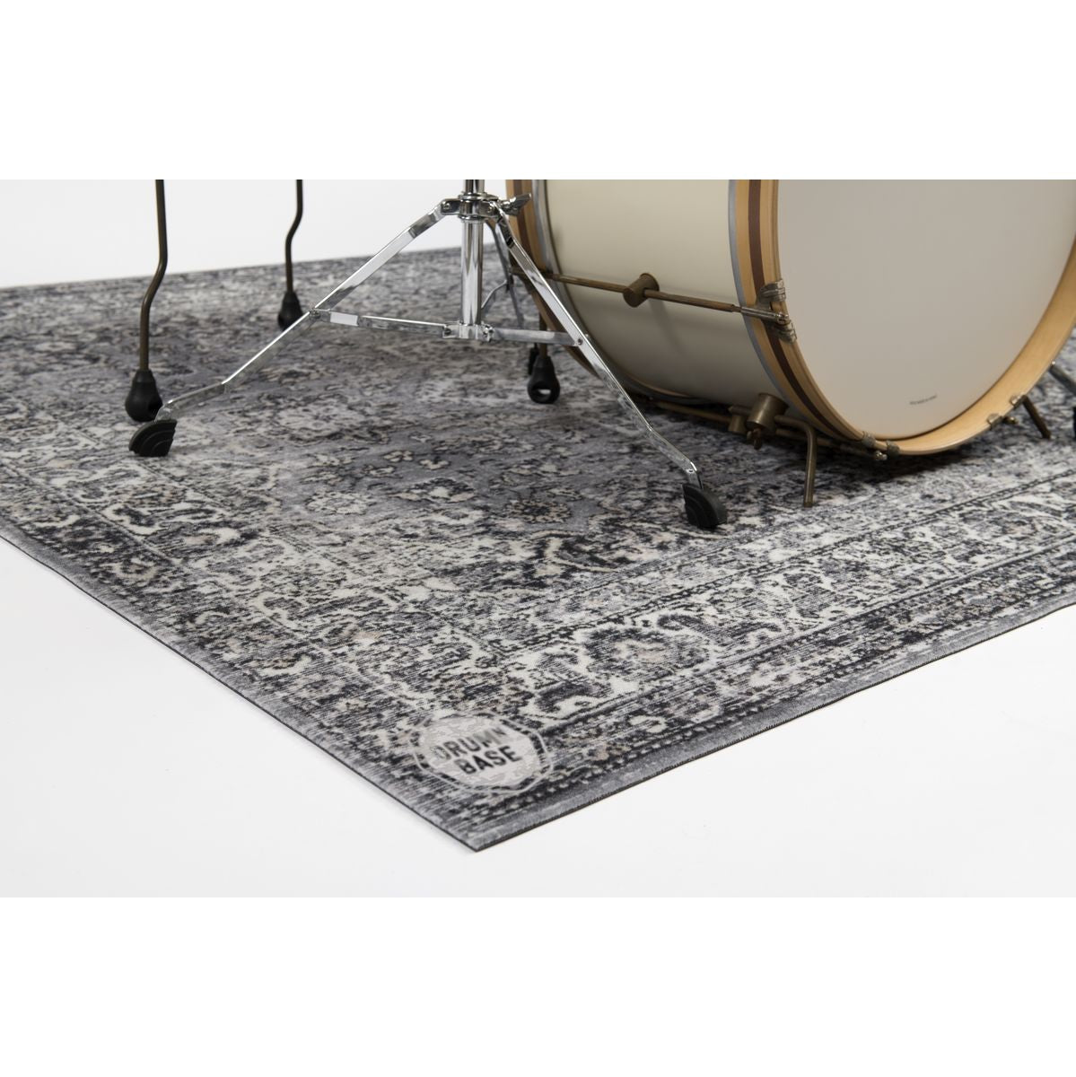 Close-up of a drum kit on the DRUMnBASE Vintage Persian Club Series Grey 165x142cm carpet with a classic Persian pattern