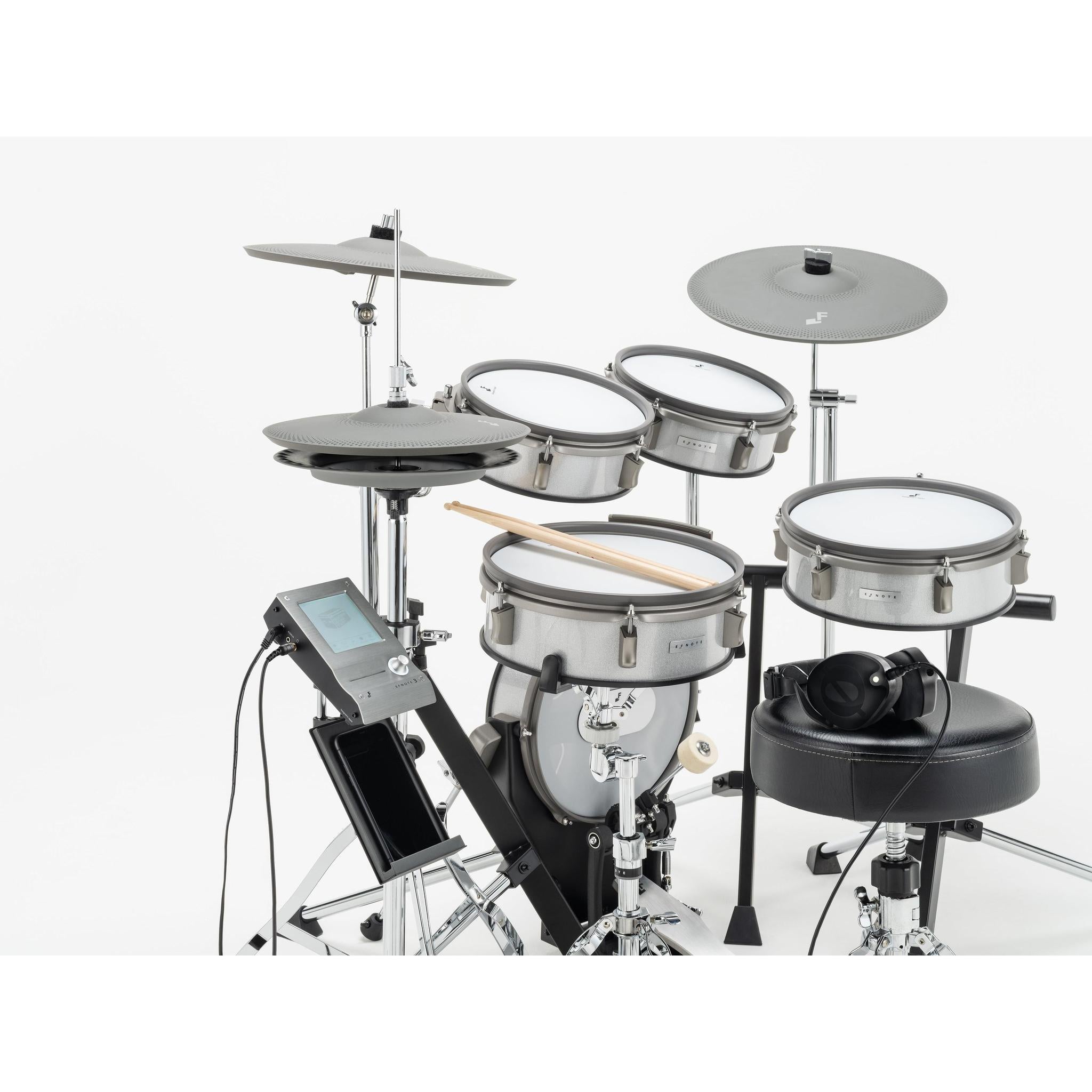EFNOTE 3 Style-A electronic drums with compact design, metal shells, drumsticks, and headphones on drum stool