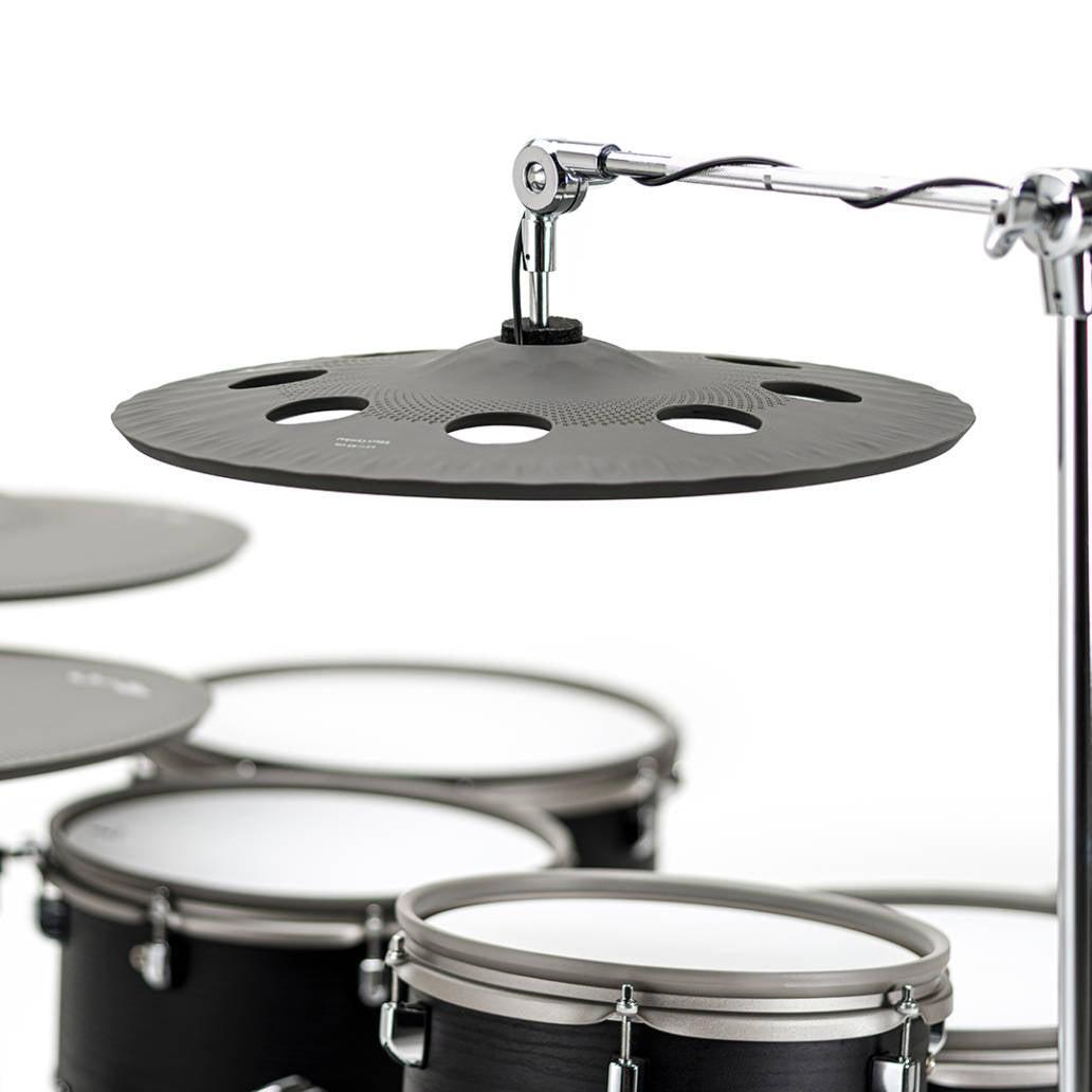 Close-up of black EFNOTE 7X e-drum set cymbal pad suspended on chrome stand by EFNOTE vendor.