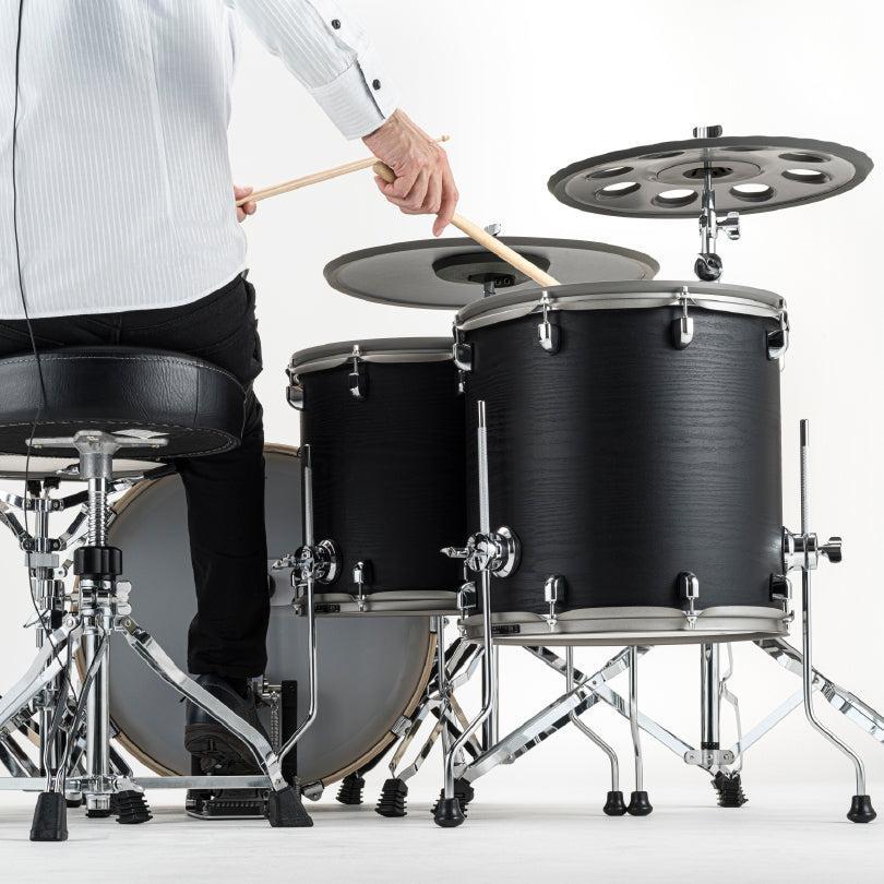 Person playing EFNOTE 7X e-drum set with black shell floor tom and cymbals on chrome stands