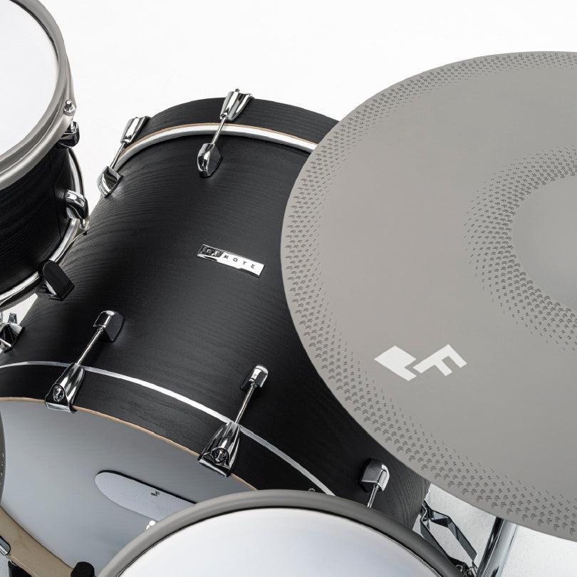 Close-up of EFNOTE 7X e-drum set showcasing the black shell drum and textured gray cymbal with EFNOTE branding.