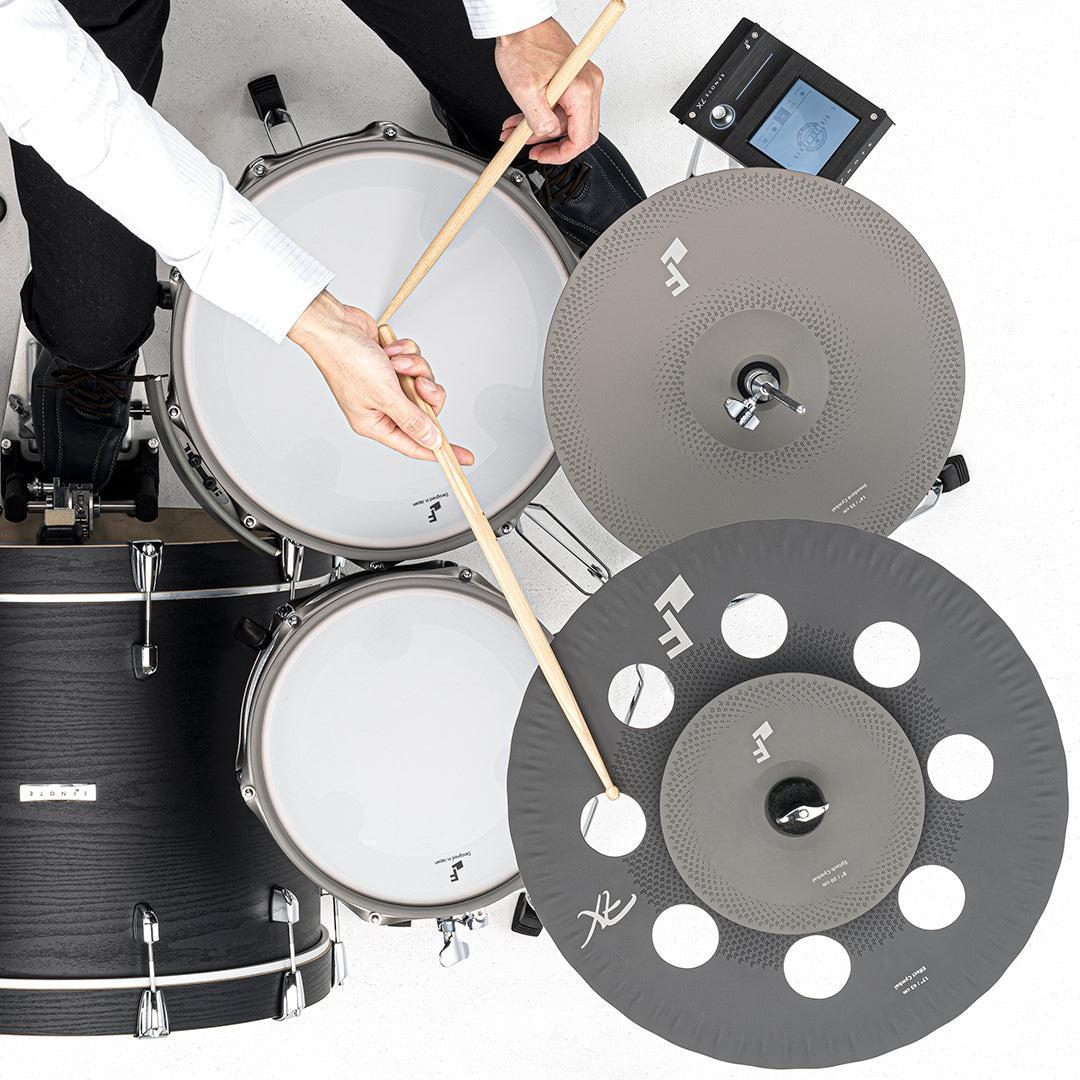 EFNOTE 7X e-drum set by EFNOTE with electronic cymbals and drum pads being played with drumsticks