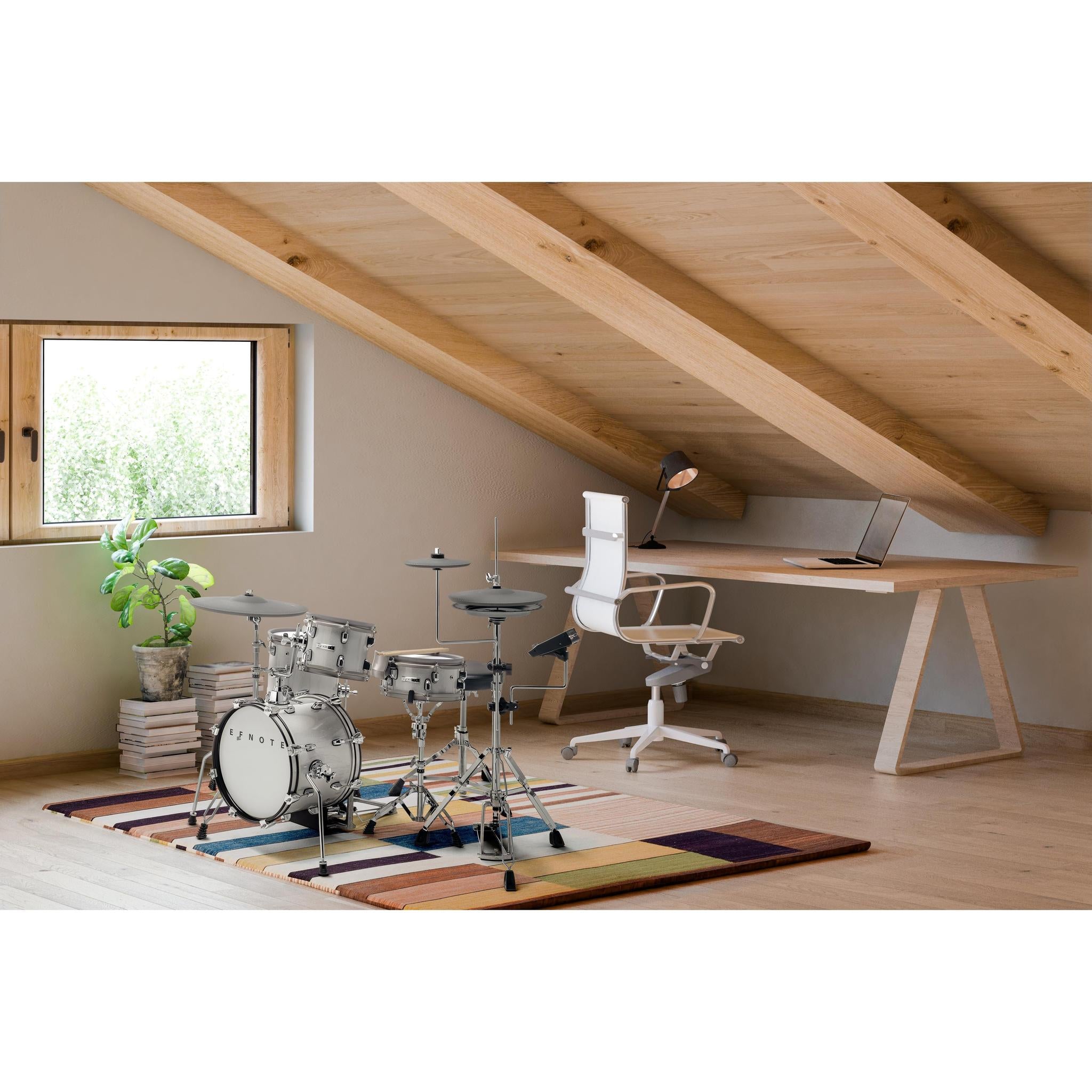 EFNOTE mini electronic drumset displayed in a modern home office with natural wood and greenery accents