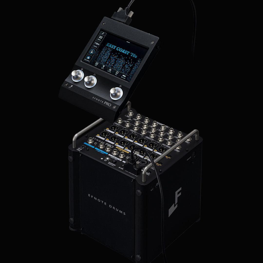 EFNOTE PRO 703X electronic drum module mounted on a black EFNOTE Drums base with controls and display screen