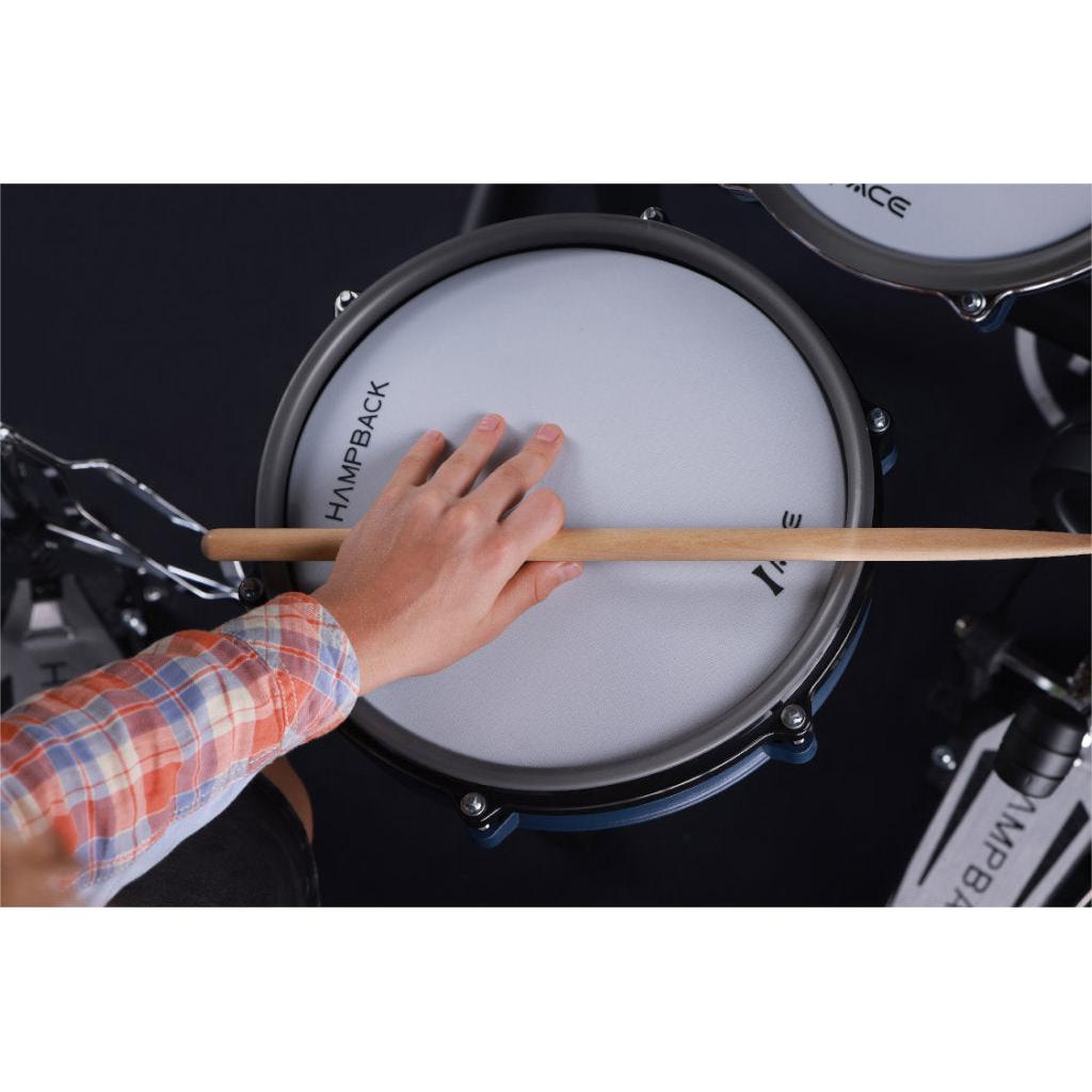 Close-up of hand playing snare drum on Hampback ACE-360 e-drum set with wooden drumstick in plaid shirt
