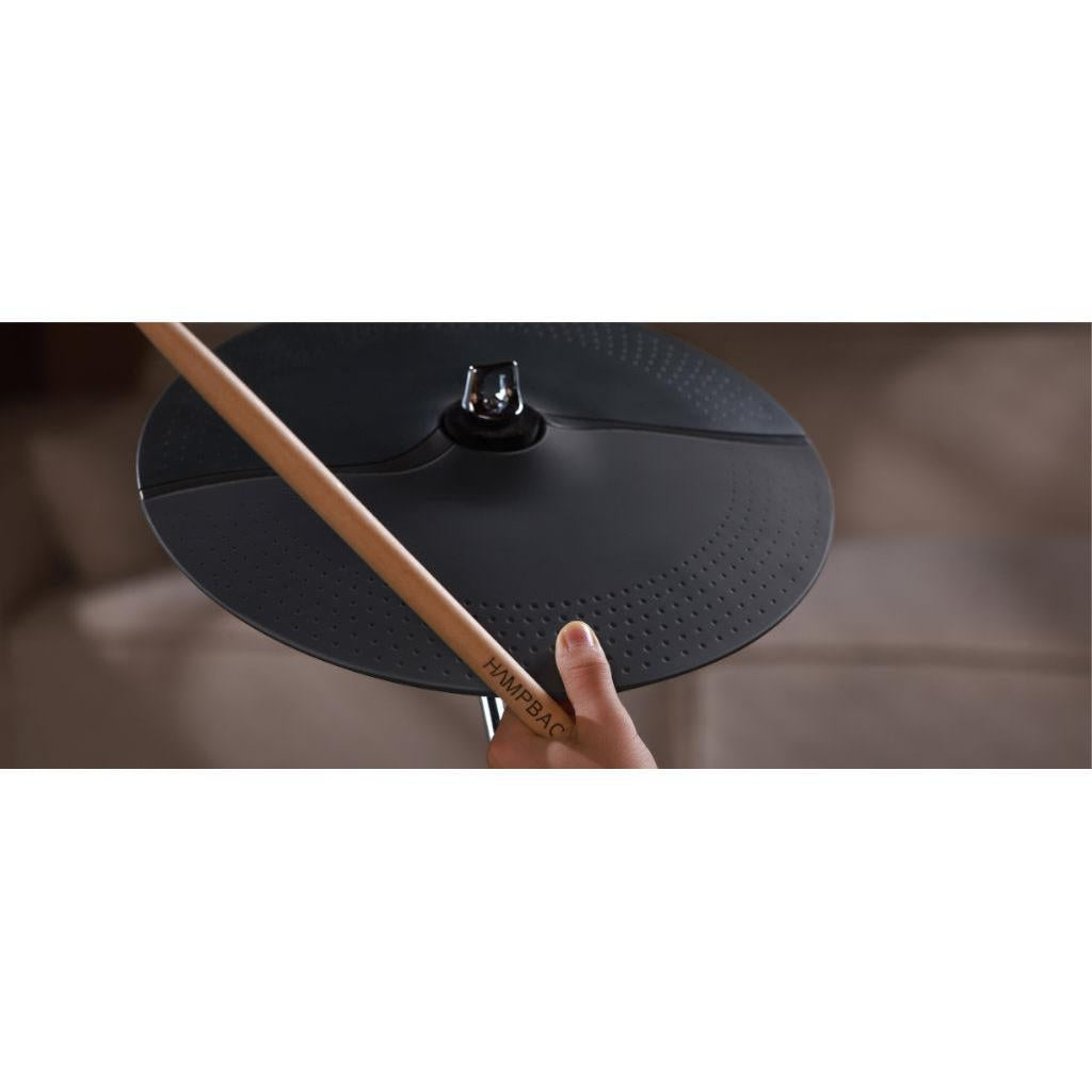 Close-up of a cymbal and drumstick from the Hampback ACE-360 e-drum set showing compact design and quality materials