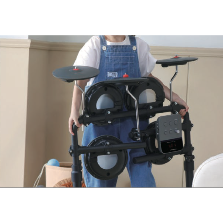 Child holding folded Hampback MK-0 electronic drum set for beginners and children by Hampback in a room setting
