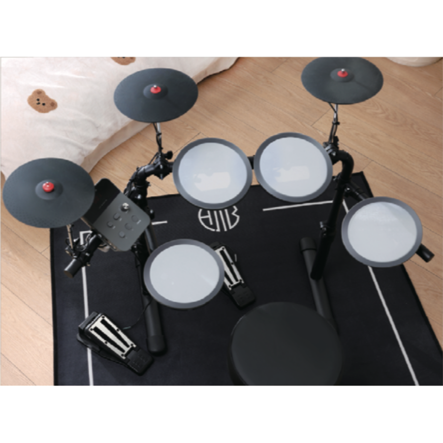 Hampback MK-0 electronic drum set for beginners and children in a compact, space-saving design by Hampback on a wooden floor.