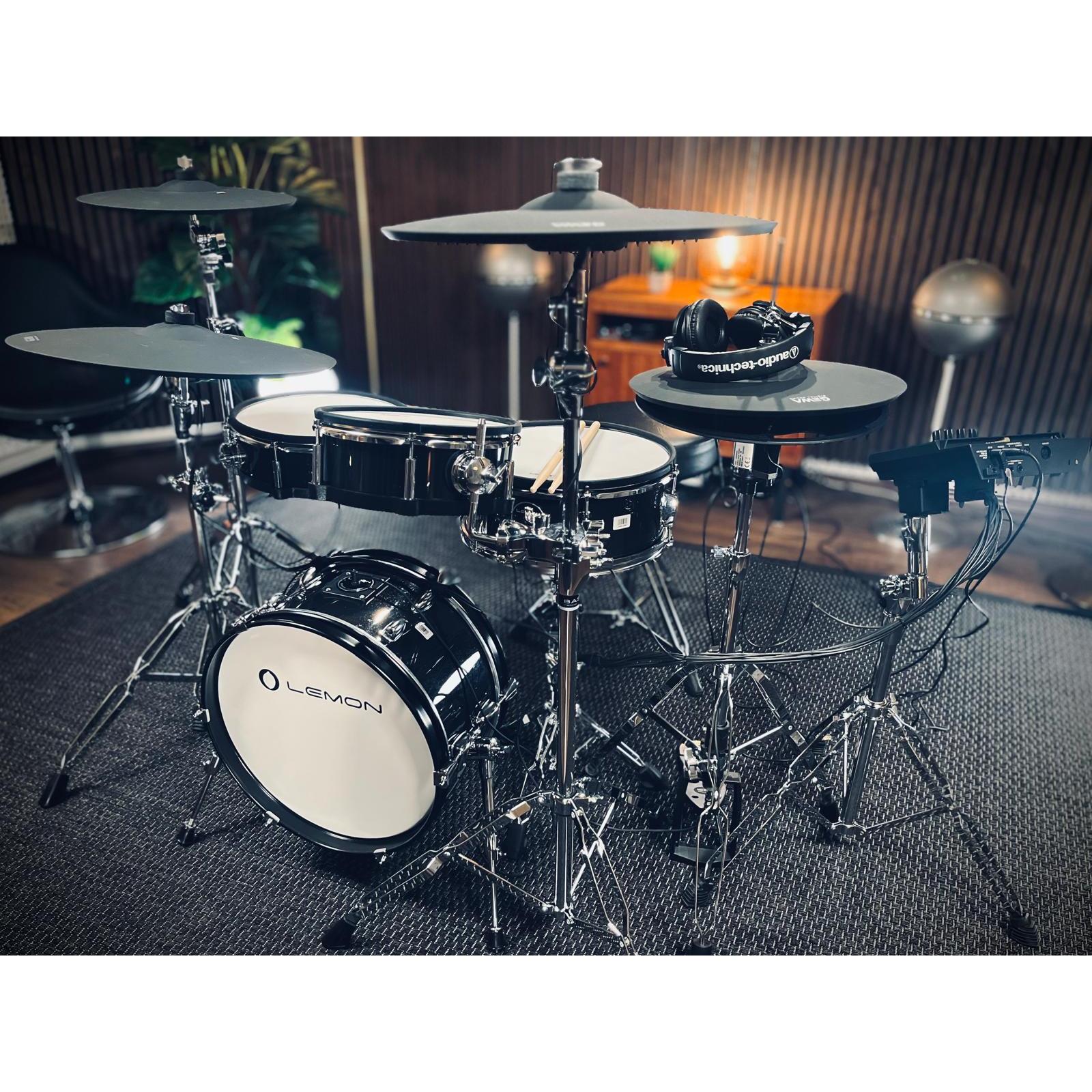 Jack Lemon drum kit with black sparkling shells and SpareDrum hardware in a cozy music room setting