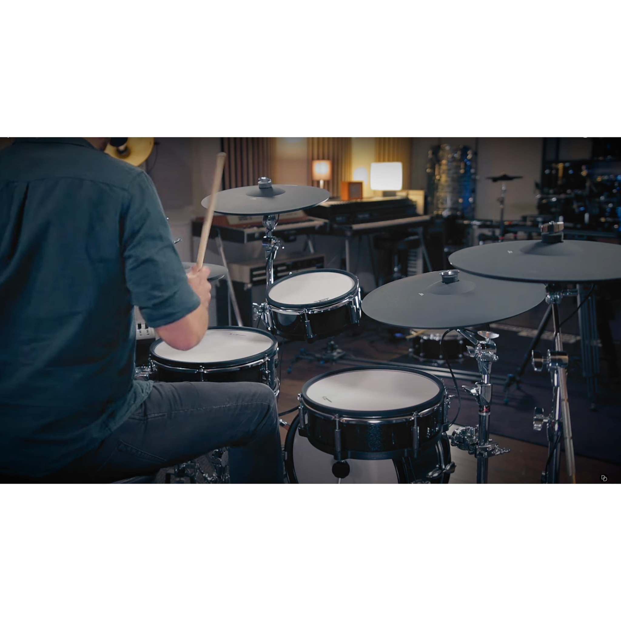 Jack Lemon drum kit with black sparkling shells and 2-ply mesh heads played by a drummer in a studio setting