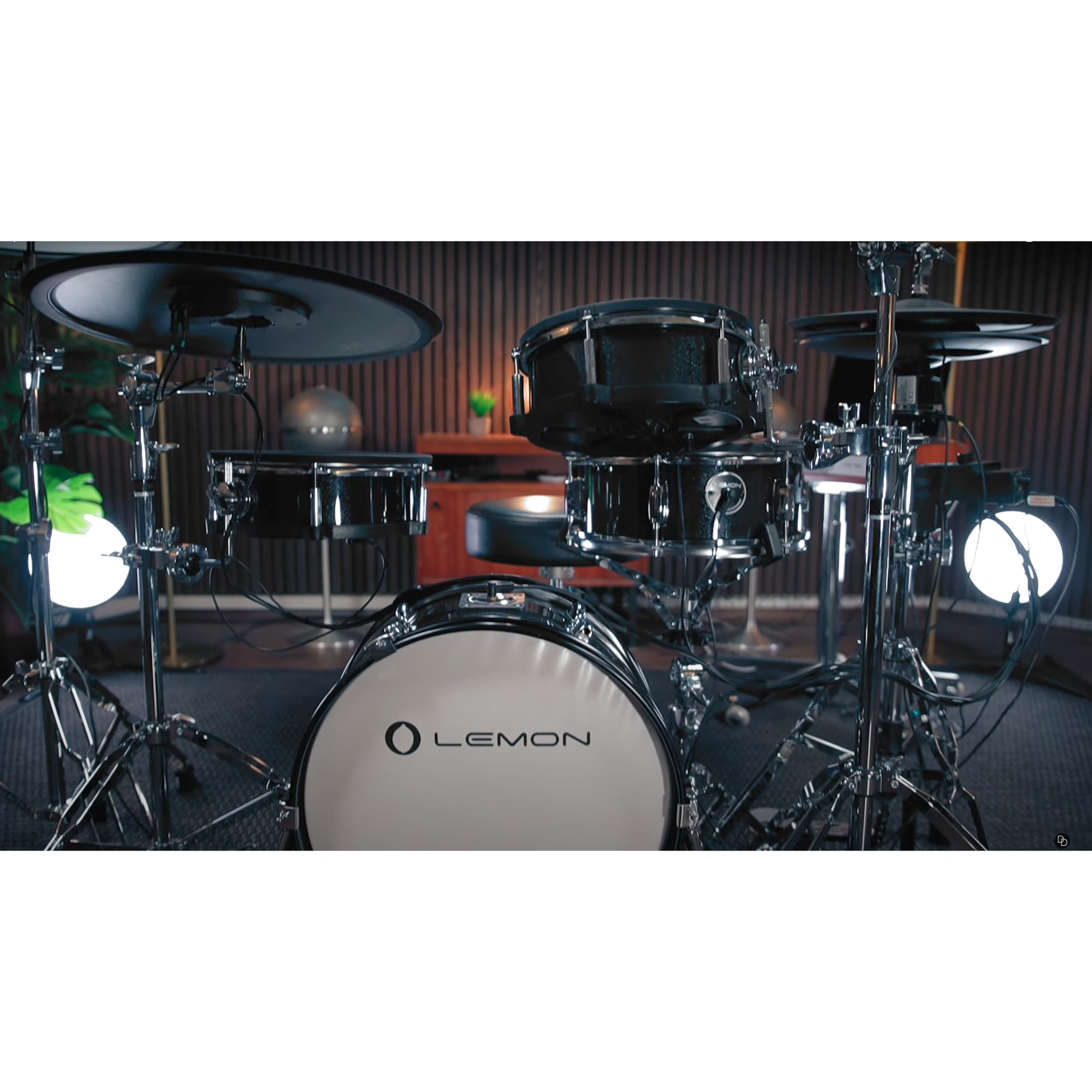 Jack Lemon drum kit with black sparkling shells and SpareDrum hardware in a modern studio setting by Lemon.