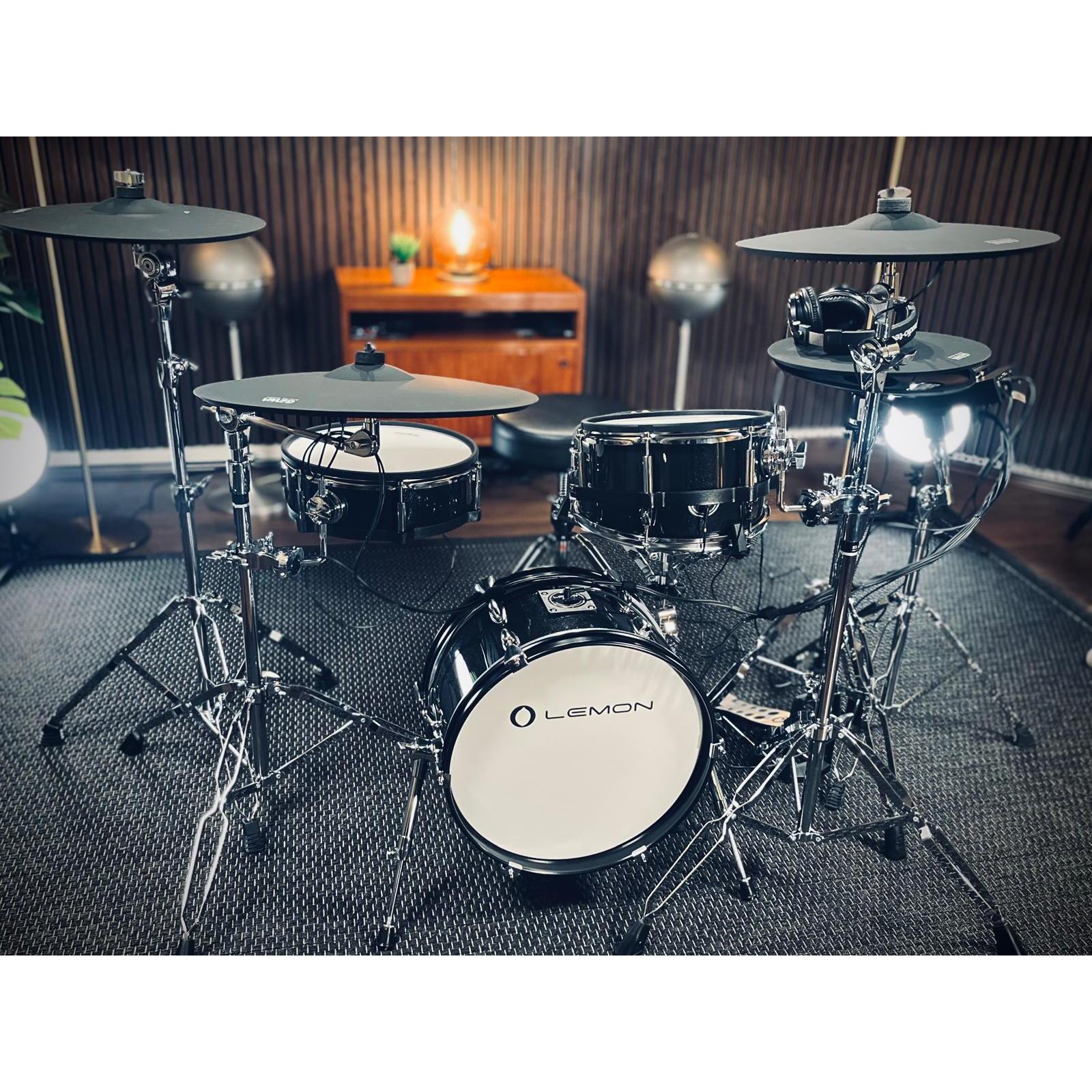 Jack Lemon drum kit with black sparkling shells, SpareDrum hardware, and compact design by Lemon in a practice room setting