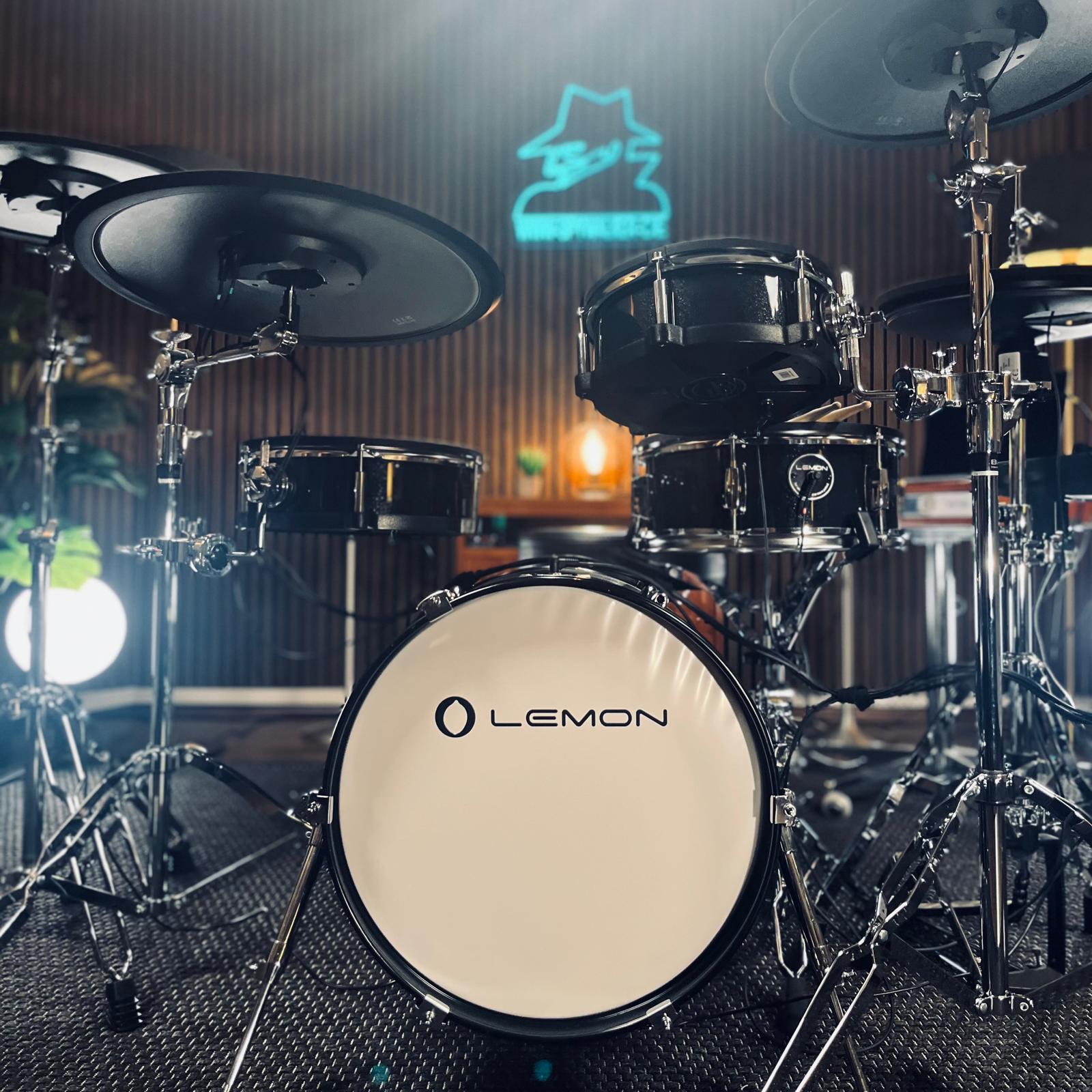 Jack Lemon drum kit by Lemon with black sparkling shells and SpareDrum hardware in a music studio setting