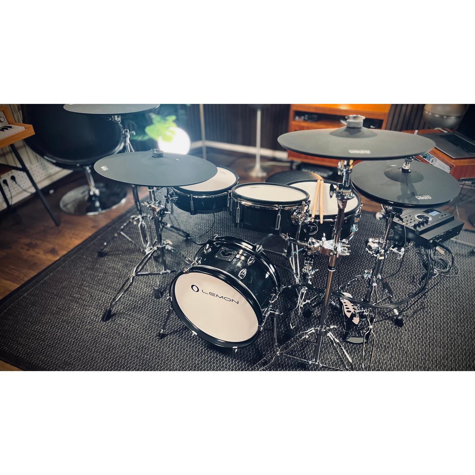Jack Lemon drum kit with black sparkling shells and 2-ply mesh heads by Lemon and SpareDrum hardware