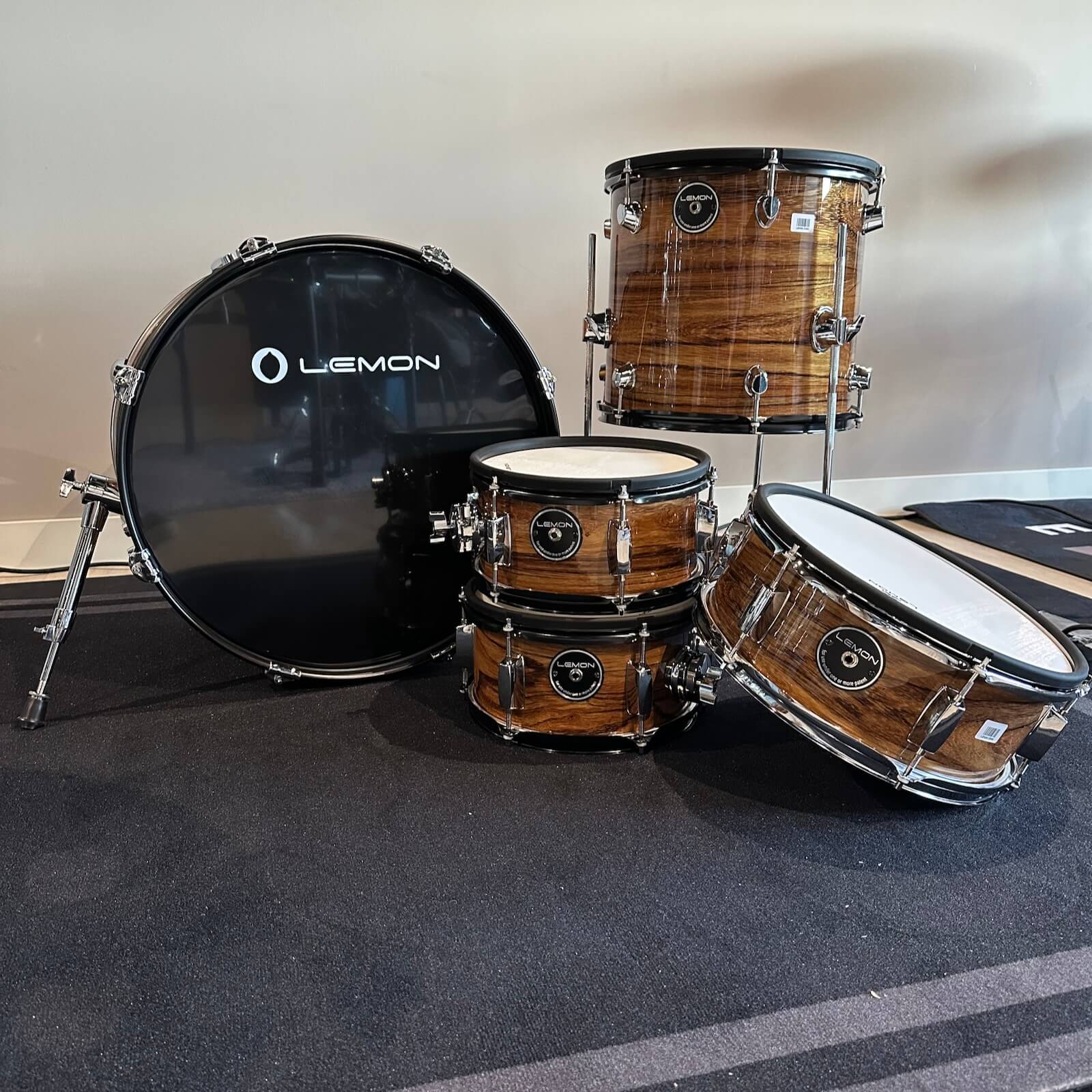 Lemon Dark Wood Grain rock e-drum shell set with real wood shells in dark brown finish and black bass drum head