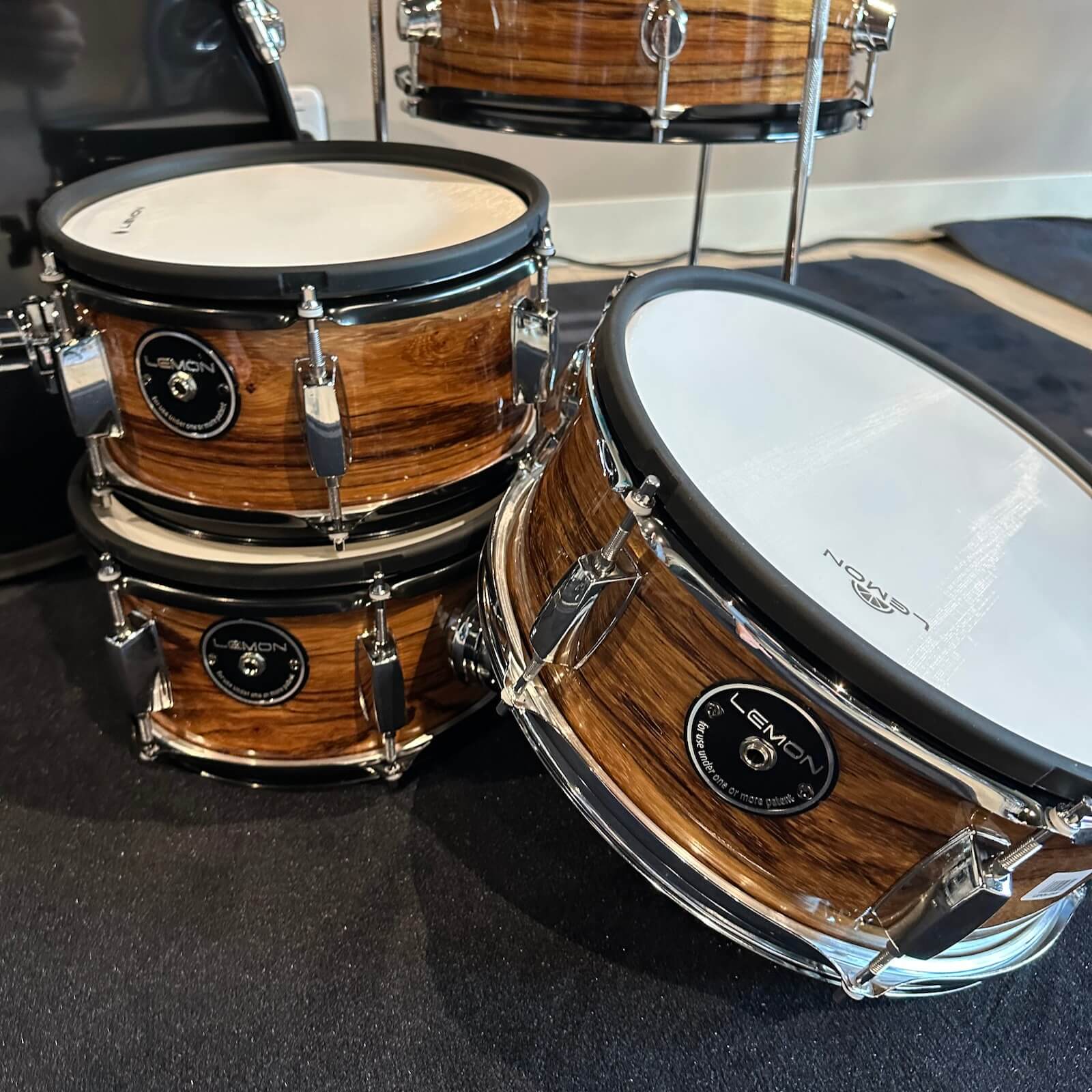 Lemon Dark Wood Grain rock e-drum shell set with real wood shells in a warm dark brown finish by Lemon