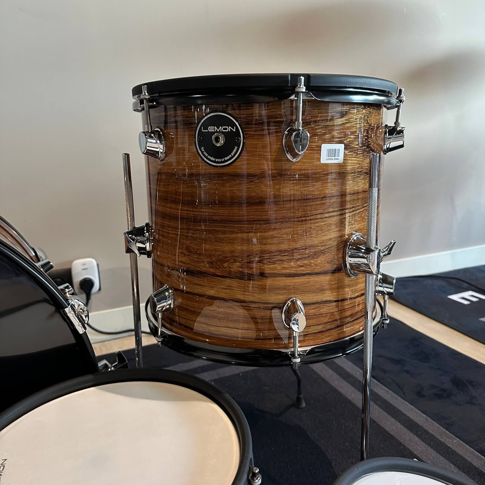 Lemon Dark Wood Grain rock e-drum shell set featuring a dark brown wood finish and chrome hardware by Lemon.