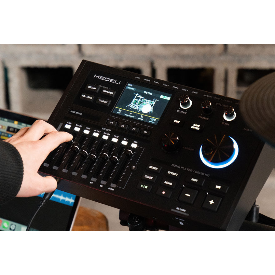 Close-up of a hand adjusting controls on the Medeli MZ923 digital drum kit sound module with vintage design elements.