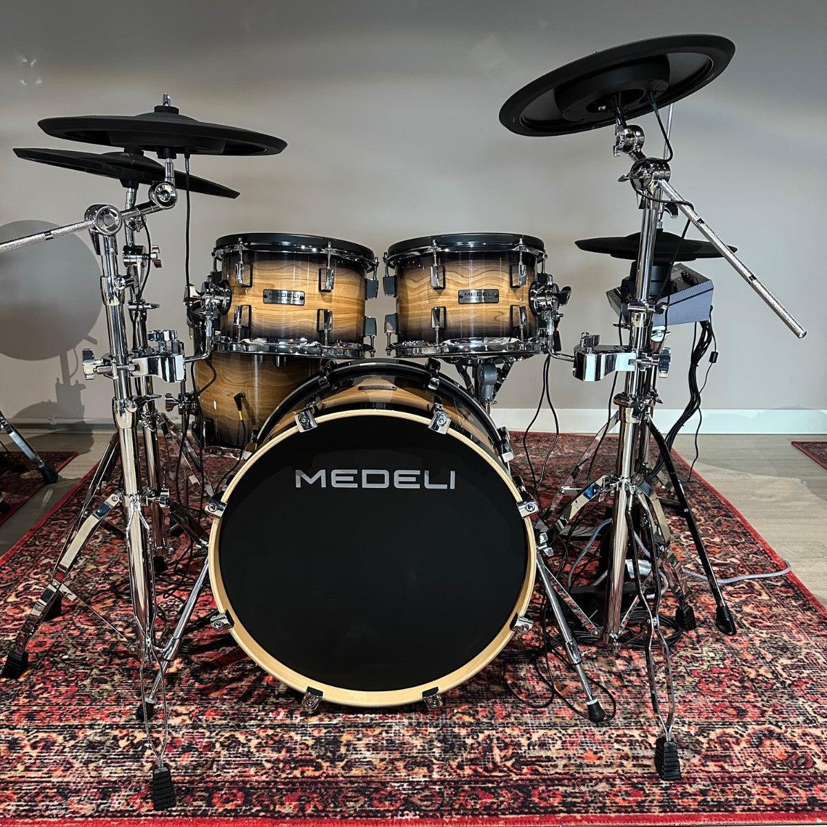 Medeli MZ928 - Flagship digital drum kit with full-size wooden shells and premium stage-ready finish on patterned rug