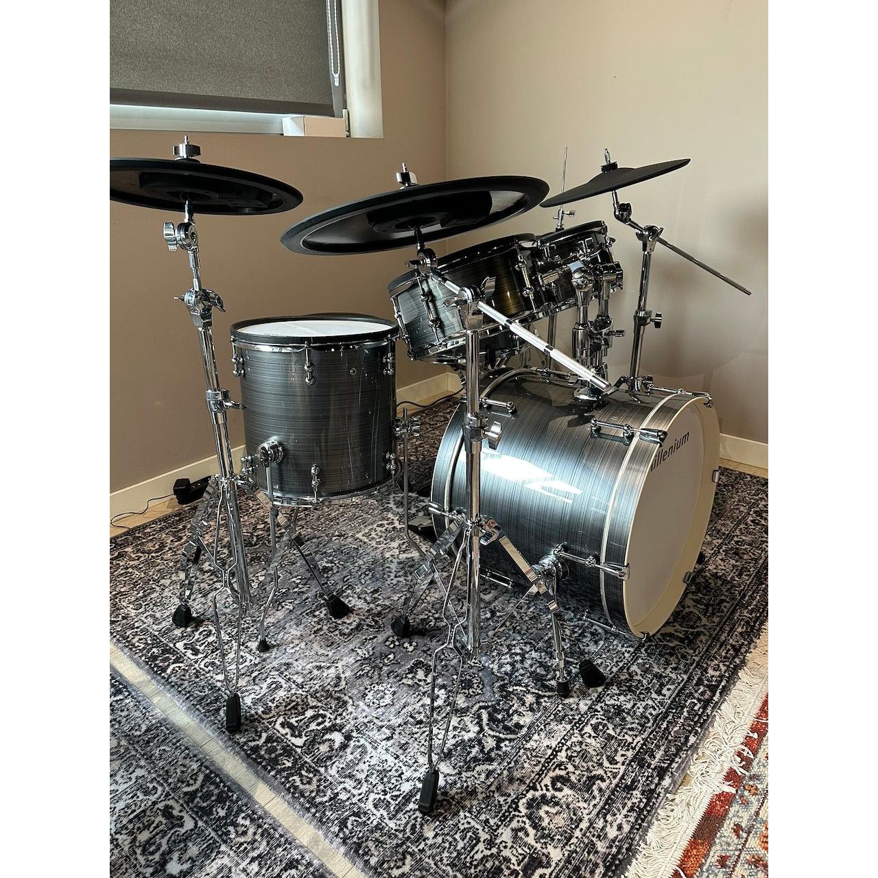 Millenium MPS-1000 E-Drum set (Pre-Owned) with real wooden shells and full warranty in a home setting on patterned rug