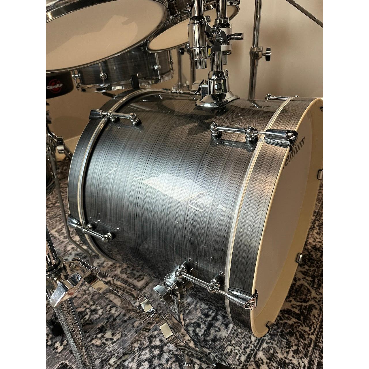 Millenium MPS-1000 E-Drum set (Pre-Owned) bass drum with real wooden shell and chrome hardware on patterned rug