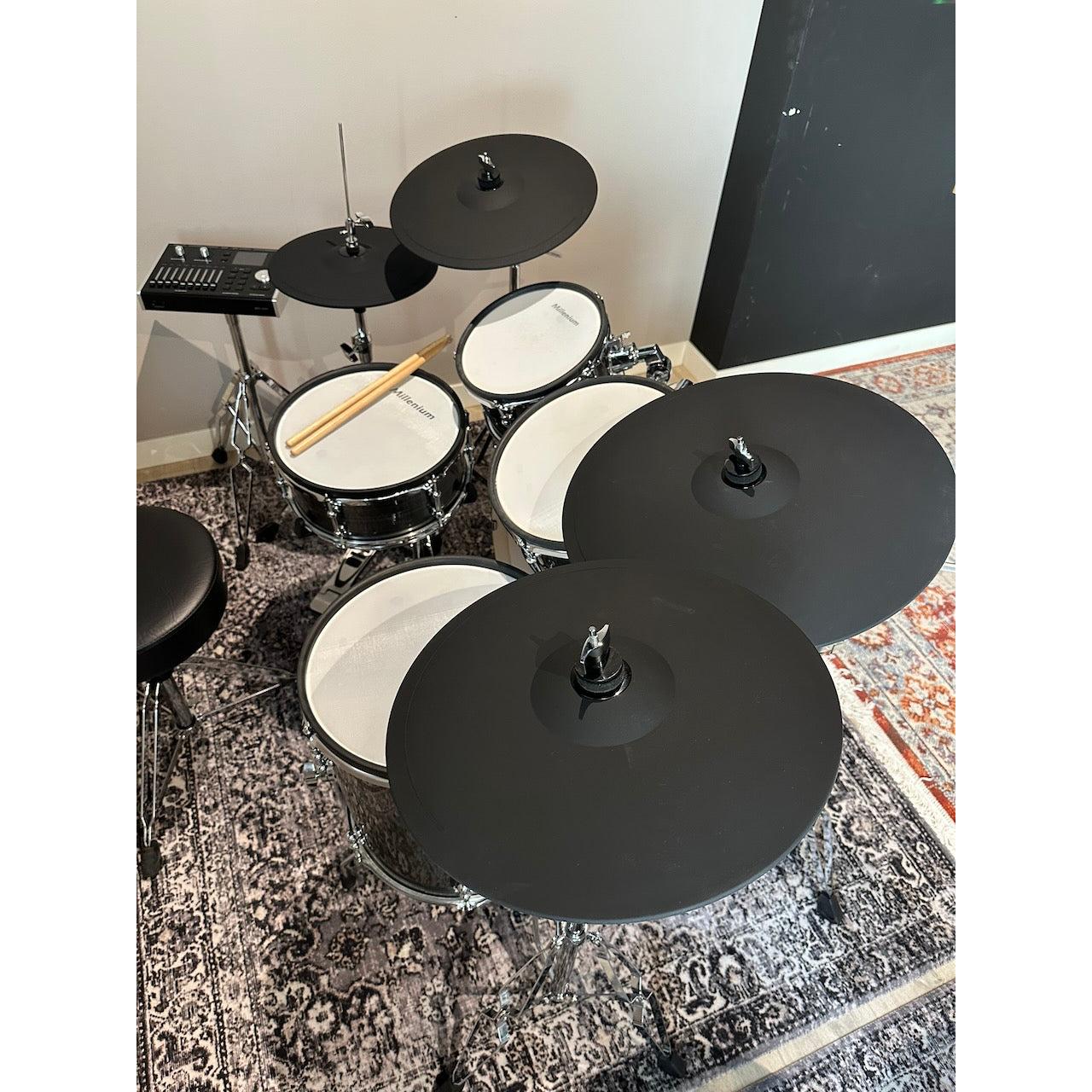 Millenium MPS-1000 E-Drum set (Pre-Owned) electronic drum kit with wooden shells and pads on a patterned rug.