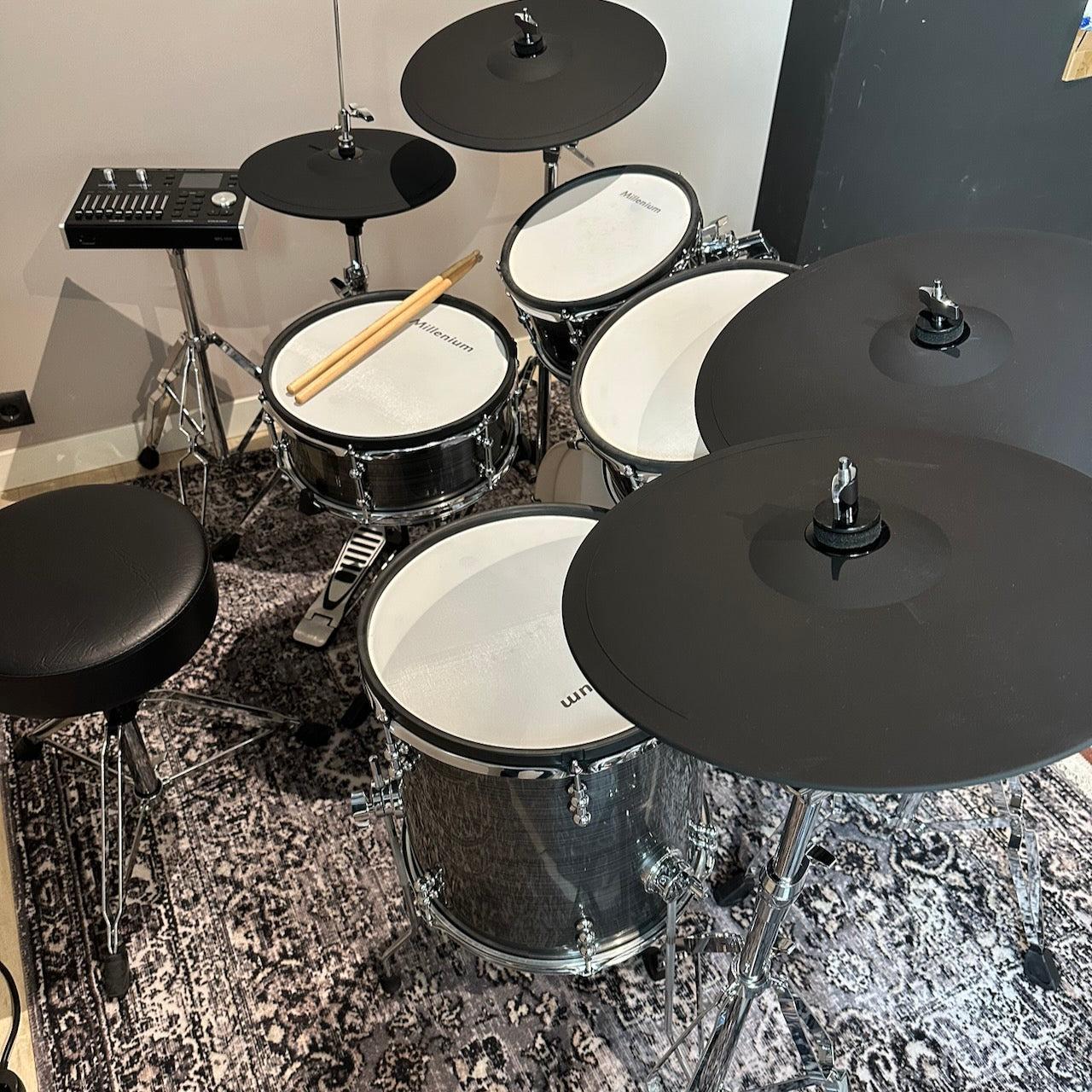Millenium MPS-1000 E-Drum set (Pre-Owned) with real wooden shells and complete drum pads on patterned rug