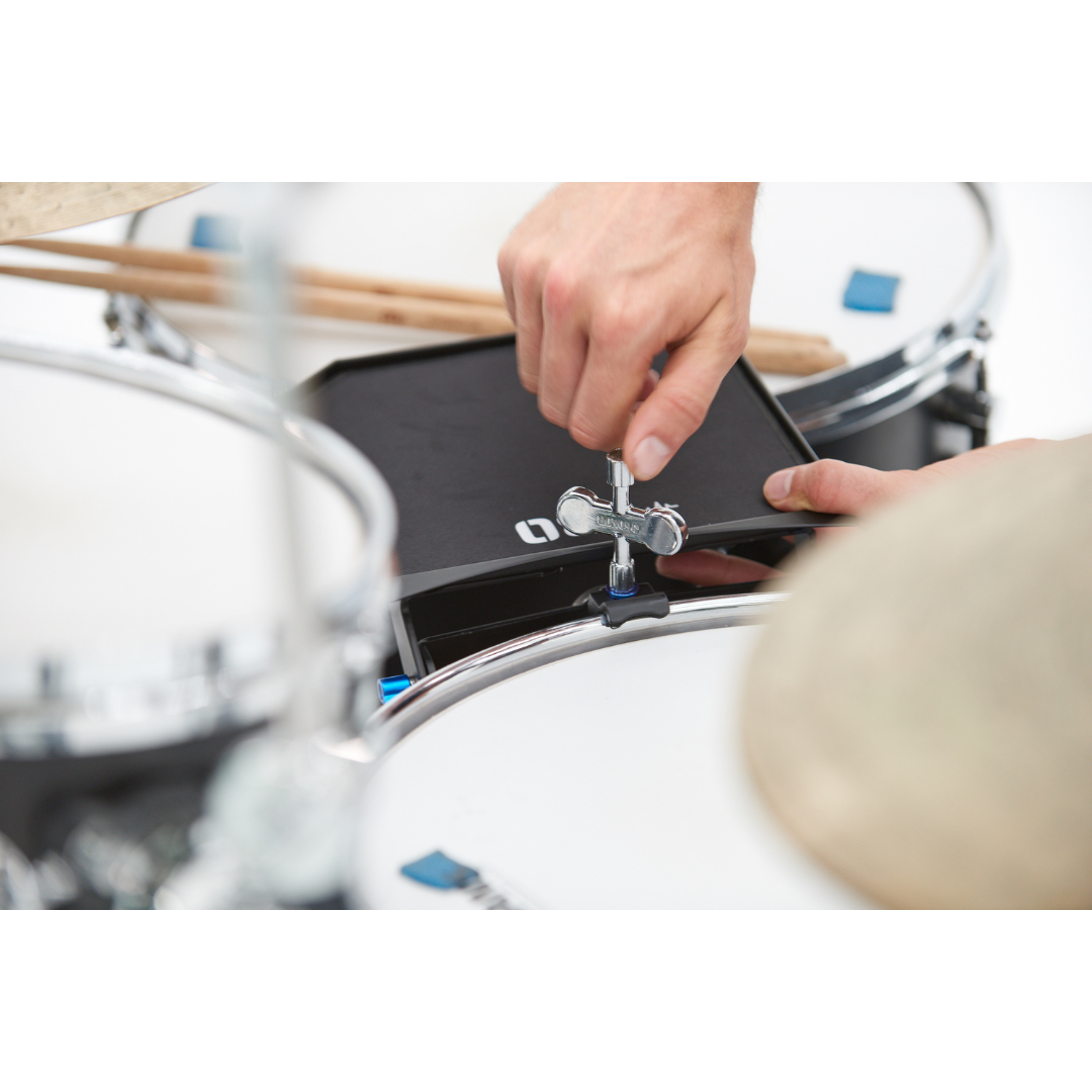 NBO Oneboard - Essential Pack being installed on a drum hoop with a tuning key by NBO, showcasing premium Swiss quality.