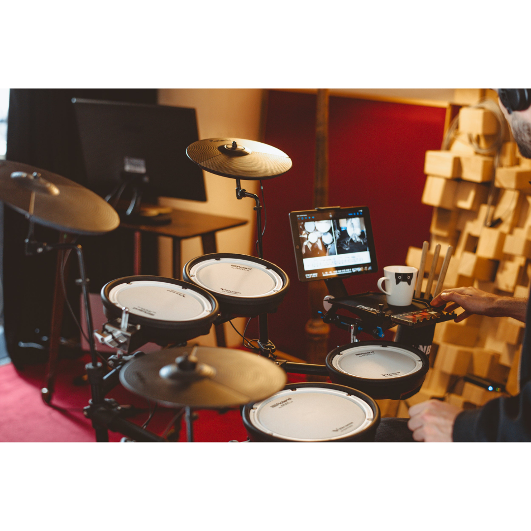 NBO Oneboard - Full Pack modular gear tray mounted on electronic drum kit with tablet and mug nearby in studio