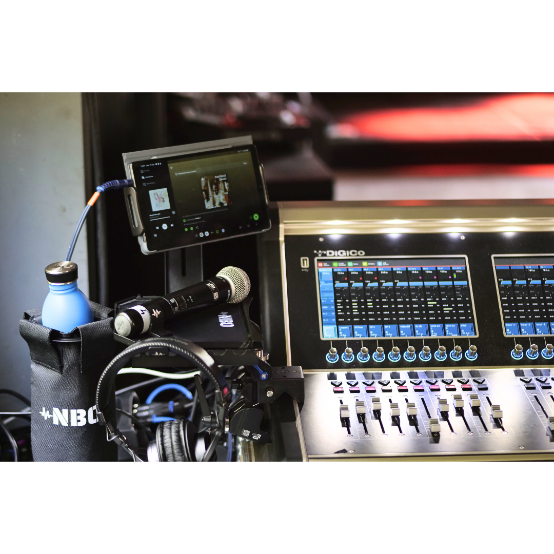 NBO Oneboard - Full Pack mounted on audio equipment holding microphone, headphones, water bottle, and tablet in studio setup