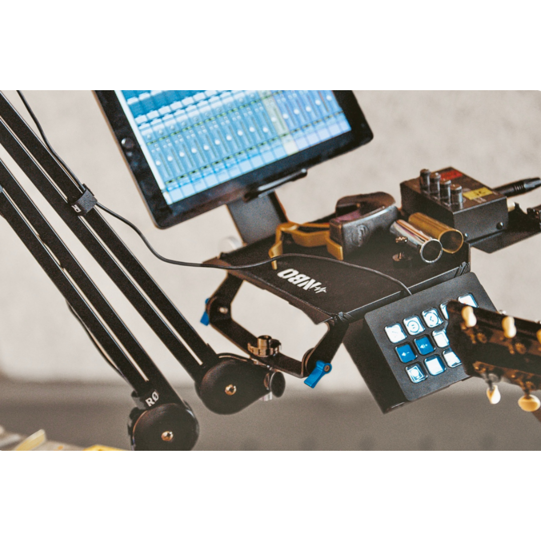 NBO Oneboard - Full Pack mounted with music gear, audio mixer screen, and guitar in studio setup by NBO.