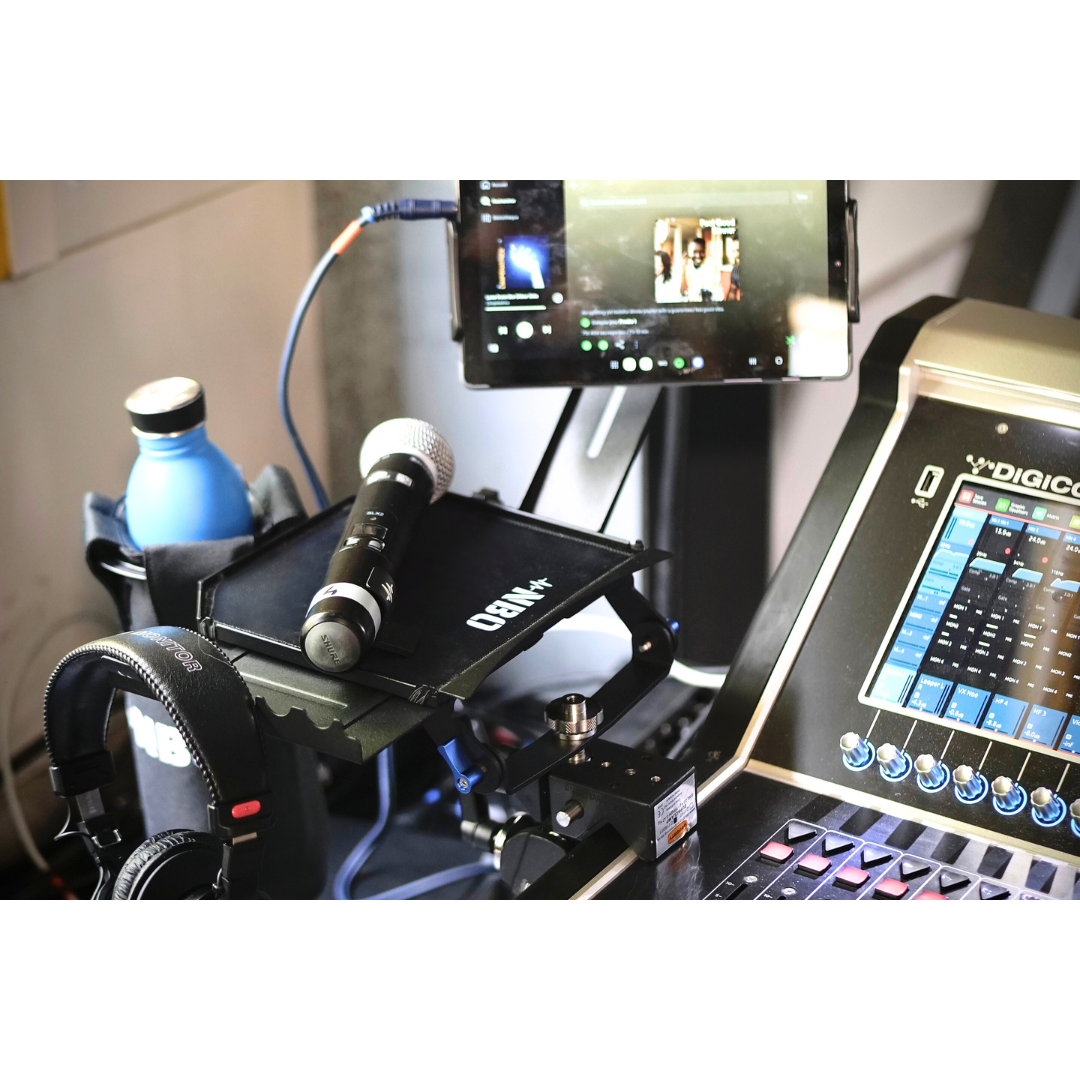 NBO Oneboard - Performance Pack holding microphone and water bottle beside audio mixer and headphones in studio setup