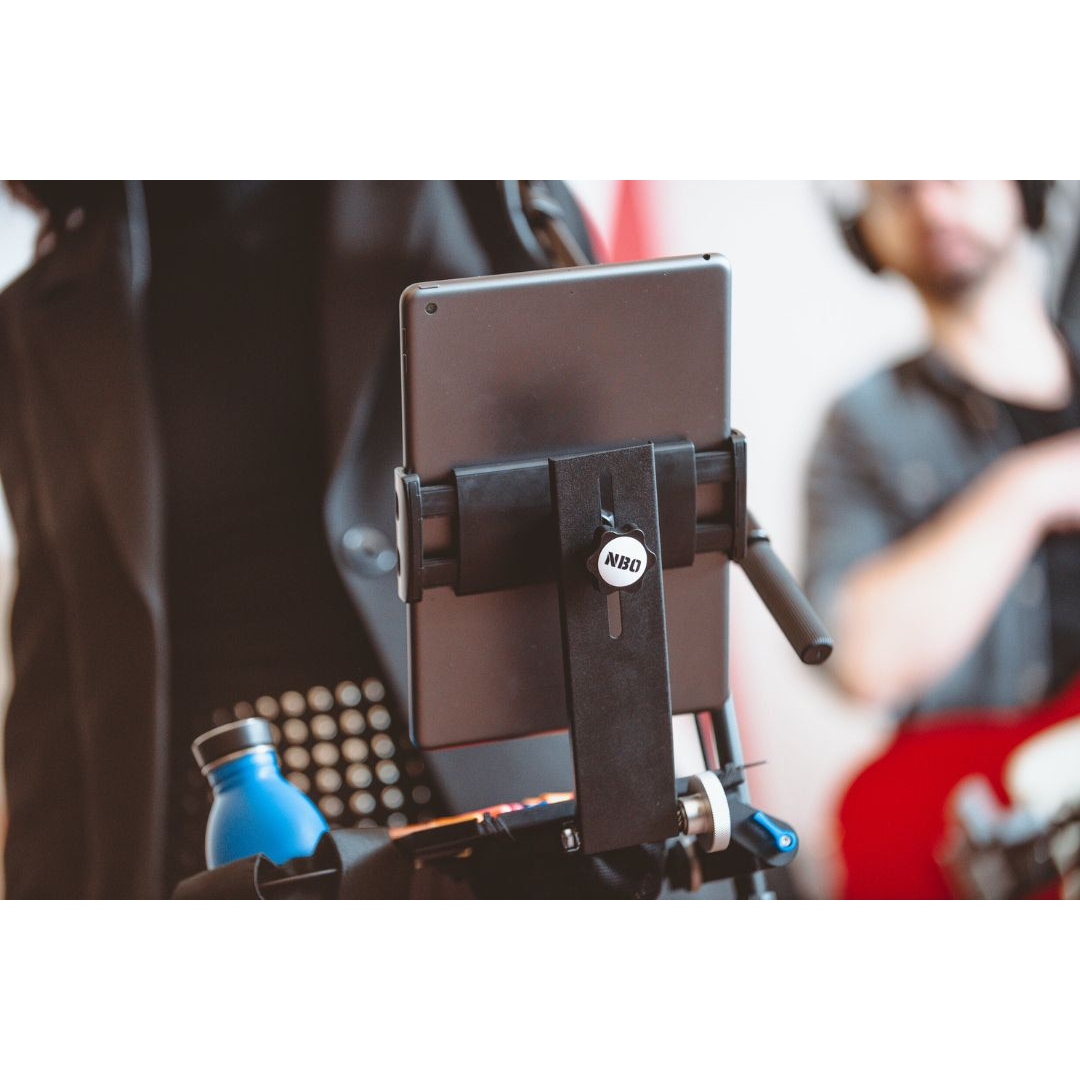 NBO Tablet/Phone Holder for Oneboard holding a tablet on a solid rotative arm in a modern practice setting.