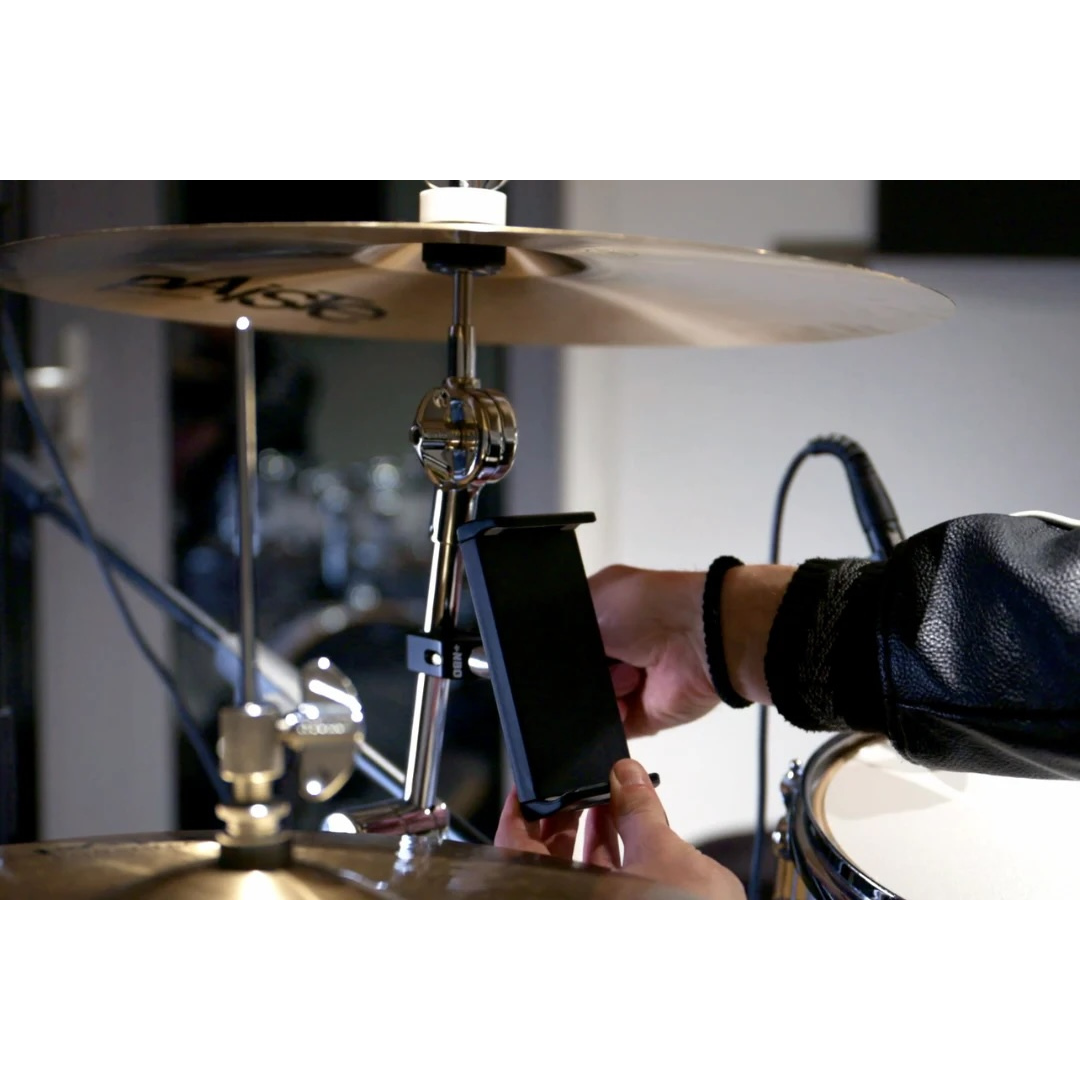 NBO Universal Tablet/Phone Holder mounted on a cymbal stand, holding a device for easy access by a musician.