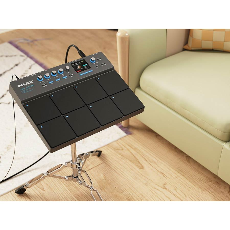 NUX DP-2000 Digital Percussion Pad with 8 velocity-sensitive pads on a stand in a room setting