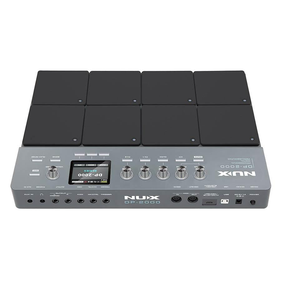 NUX DP-2000 Digital Percussion Pad with eight velocity-sensitive pads and multiple control knobs on a silver base.